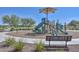 Outdoor playground with slides, climbing structures, and a sunshade offers a fun recreation space at 17140 W Running Deer Trl, Surprise, AZ 85387