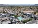 Wide aerial view showcasing a planned community with a central pool area at 1879 W 23Rd Ave, Apache Junction, AZ 85120