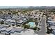 Aerial view showcases a well-maintained community pool and lush landscaping at 1879 W 23Rd Ave, Apache Junction, AZ 85120