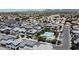 Community aerial view features a large pool, well-kept landscaping, and plentiful parking at 1879 W 23Rd Ave, Apache Junction, AZ 85120