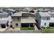 A tan two-story house with a small yard and fence in the back at 1879 W 23Rd Ave, Apache Junction, AZ 85120