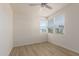 Bright and airy bedroom with large windows, ceiling fan, and light wood floors at 1879 W 23Rd Ave, Apache Junction, AZ 85120