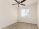 Bright bedroom features a ceiling fan and a window that allows natural light to illuminate the space at 1879 W 23Rd Ave, Apache Junction, AZ 85120
