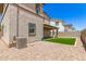 Exterior view of home showcasing a covered patio and turf grass at 1879 W 23Rd Ave, Apache Junction, AZ 85120