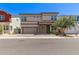Street view of a modern two-story home boasting neutral stucco, a two-car garage, and low-maintenance front yard landscaping at 1879 W 23Rd Ave, Apache Junction, AZ 85120