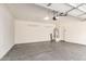 Spacious garage features epoxy floor, overhead storage racks, and a water heater for convenience at 1879 W 23Rd Ave, Apache Junction, AZ 85120