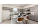 Kitchen featuring granite countertops, stainless appliances, an island with seating, and gray cabinets at 1879 W 23Rd Ave, Apache Junction, AZ 85120
