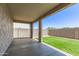 Covered patio that overlooks a beautiful turf grass area, perfect for outdoor relaxation and entertaining at 1879 W 23Rd Ave, Apache Junction, AZ 85120