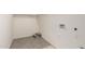 Tile floor in a storage room, featuring a utility hookup, perfect for organization and storage at 1879 W 23Rd Ave, Apache Junction, AZ 85120