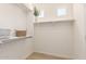 Spacious walk-in closet with shelves, a decorative basket, and natural light at 1879 W 23Rd Ave, Apache Junction, AZ 85120