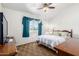 Cozy bedroom featuring neutral carpet, a ceiling fan and a window at 18805 N 49Th Dr, Glendale, AZ 85308