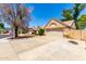 This well-maintained house has a two-car garage and desert landscaping in a well manicured neighborhood at 18805 N 49Th Dr, Glendale, AZ 85308