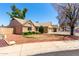 Single story home with desert landscaping, red rock, and grass with a two car garage at 18805 N 49Th Dr, Glendale, AZ 85308