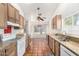 Spacious kitchen with granite countertops, tiled floor, plenty of cabinet space and stainless steel sink at 18805 N 49Th Dr, Glendale, AZ 85308