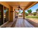 Covered patio with tiled flooring and a ceiling fan overlooking the backyard at 18805 N 49Th Dr, Glendale, AZ 85308