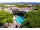 Backyard pool and a sport court blend luxury and recreation in this real estate gem at 22020 N Church Rd, Scottsdale, AZ 85255