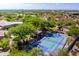 A large estate featuring a sport court and lush landscaping, captured from above at 22020 N Church Rd, Scottsdale, AZ 85255