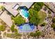 An aerial perspective reveals a sprawling property with a sport court and pool at 22020 N Church Rd, Scottsdale, AZ 85255