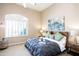 Cozy bedroom with a large window, soft lighting, and modern decor at 22020 N Church Rd, Scottsdale, AZ 85255