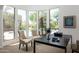 Bedroom office area with large bay window and views of the lush backyard and pool at 22020 N Church Rd, Scottsdale, AZ 85255