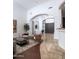 Bright foyer with arched architecture, tile, and hardwood floors offers a view into the living area at 22020 N Church Rd, Scottsdale, AZ 85255