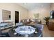 Spacious game room with poker table, couches, and a flat-screen TV for entertainment at 22020 N Church Rd, Scottsdale, AZ 85255
