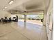 Bright, open garage interior with plenty of space for parking and storage at 22020 N Church Rd, Scottsdale, AZ 85255