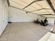 Spacious garage interior featuring ample storage and bright lighting at 22020 N Church Rd, Scottsdale, AZ 85255