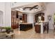 Spacious kitchen with dark wood cabinets, granite countertops, and a large center island, perfect for cooking at 22020 N Church Rd, Scottsdale, AZ 85255