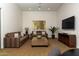 Inviting living room featuring dual sofas, a TV, and stylish decor for relaxation and entertainment at 22020 N Church Rd, Scottsdale, AZ 85255
