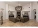 Open living room with high ceilings, stone fireplace, and ample seating at 22020 N Church Rd, Scottsdale, AZ 85255