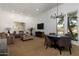 Open living space with modern lighting, comfortable seating, and views of the outdoors at 22020 N Church Rd, Scottsdale, AZ 85255