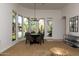 Open-concept living space with multiple windows, a dining table, and a modern design at 22020 N Church Rd, Scottsdale, AZ 85255