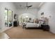 Large main bedroom with a pool view, ceiling fan, and plenty of natural light at 22020 N Church Rd, Scottsdale, AZ 85255