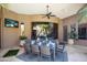 Charming outdoor dining area with seating for eight and views of the lush backyard and pool at 22020 N Church Rd, Scottsdale, AZ 85255