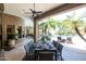 Picturesque outdoor dining space overlooking the pool, mature landscaping, and inviting lounge area at 22020 N Church Rd, Scottsdale, AZ 85255