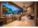 Covered patio with a complete outdoor kitchen and barbecue area at 22020 N Church Rd, Scottsdale, AZ 85255