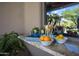 Close up of outdoor kitchen bar with fresh fruit, beverages, and desert landscape reflection at 22020 N Church Rd, Scottsdale, AZ 85255