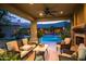 Cozy outdoor patio with comfortable seating overlooking the pool, perfect for relaxation and socializing at 22020 N Church Rd, Scottsdale, AZ 85255