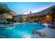 Luxurious backyard pool and hot tub with desert landscaping, ideal for relaxation and entertainment at 22020 N Church Rd, Scottsdale, AZ 85255