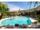 A beautiful pool with waterfalls and lush landscaping creates a backyard oasis at 22020 N Church Rd, Scottsdale, AZ 85255