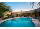 Inviting backyard pool and spa, complete with lounge chairs for relaxing and desert landscaping at 22020 N Church Rd, Scottsdale, AZ 85255
