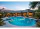 Stunning backyard pool with hot tub, desert landscaping, and elegant patio area at 22020 N Church Rd, Scottsdale, AZ 85255