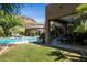 Backyard includes pool, outdoor kitchen, ping pong, and lounge chairs for outdoor living at 22020 N Church Rd, Scottsdale, AZ 85255