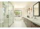 Bright bathroom with a glass shower, soaking tub, double vanities, and clean modern lines at 2315 E Mine Creek Rd, Phoenix, AZ 85024