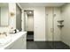 This elegant bathroom features a glass-enclosed shower, a modern vanity, and upscale fixtures at 2315 E Mine Creek Rd, Phoenix, AZ 85024