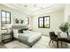 Stylish bedroom features a neutral palette, tray ceiling, and large windows for ample natural light at 2315 E Mine Creek Rd, Phoenix, AZ 85024