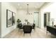 Modern dining room with stylish table and chairs, designer lighting and contemporary artwork at 2315 E Mine Creek Rd, Phoenix, AZ 85024