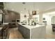 Elegant kitchen featuring custom cabinets, marble countertops, and pendant lighting at 2315 E Mine Creek Rd, Phoenix, AZ 85024