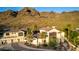 Aerial view of the home showing the roofline, driveway, and desert landscaping at 2326 E Gardenia Dr, Phoenix, AZ 85020